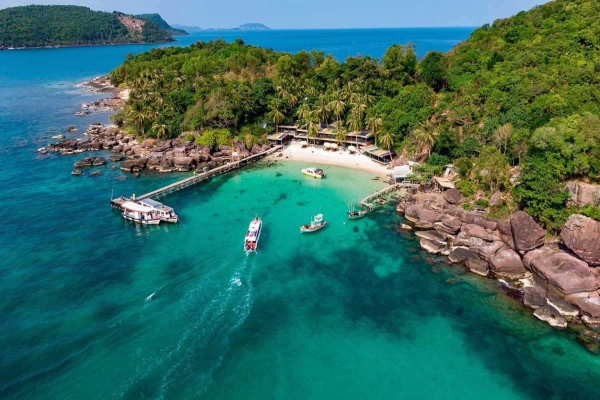 Ganh Dau Cape Aerial View Aerial view of Ganh Dau Cape showcasing the lush landscape and calm beach below.
