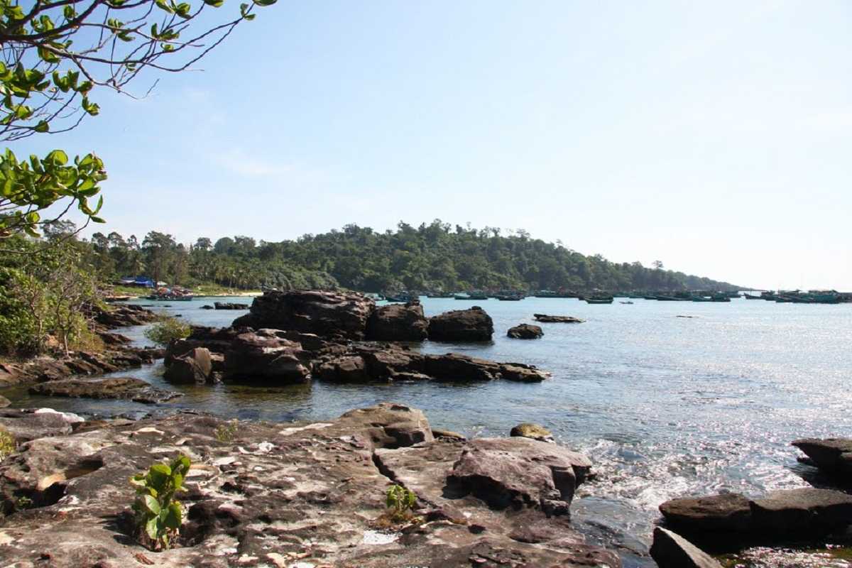 Ganh Dau Cape Overlooking the Ocean A view of the ocean from Ganh Dau Cape, with lush greenery and tranquil waters in the distance.