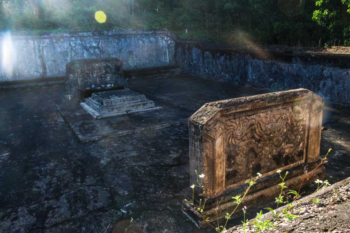 Royal Family Mausoleums at Gia Long Tomb Old royal family mausoleums with stone steles and mossy grounds at Gia Long Tomb in Hue, Vietnam.