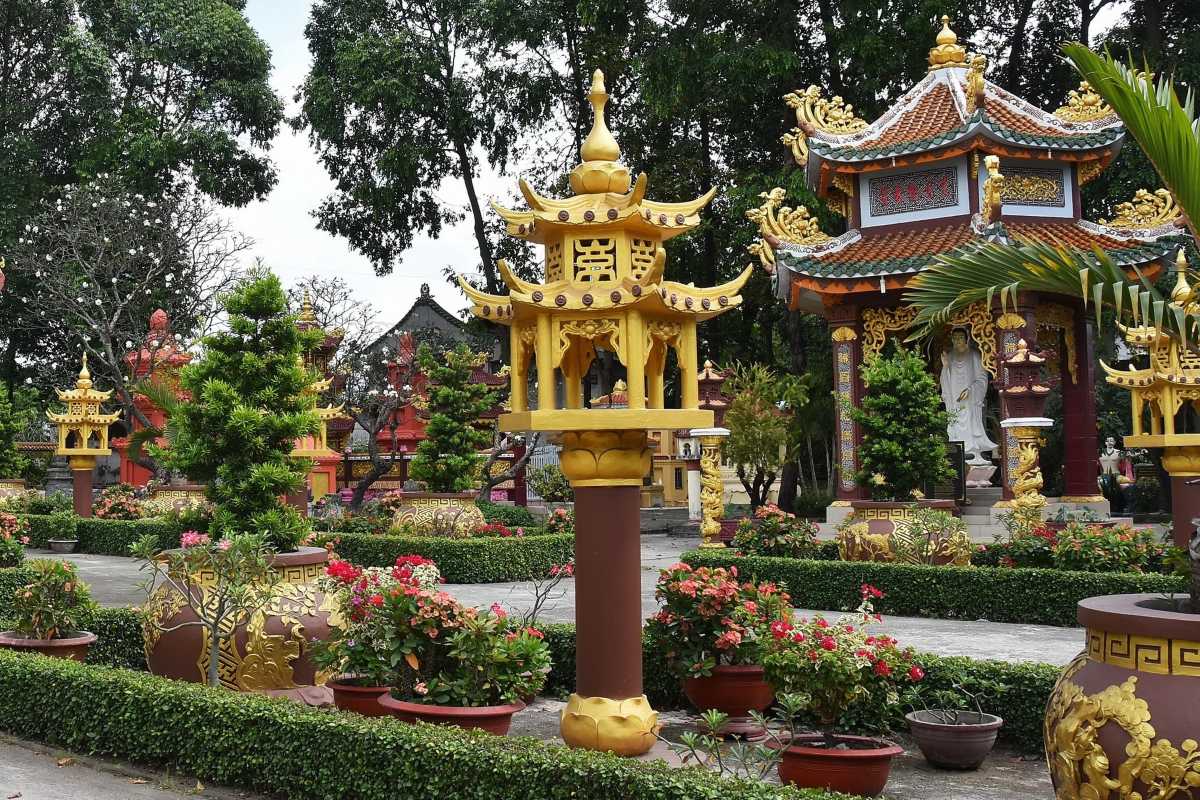 Giac Lam Pagoda Seven-Story Stupa Tall seven-story yellow stupa with ornate roof details at Giac Lam Pagoda