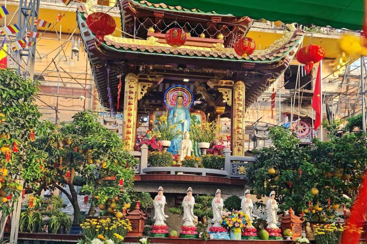 Giac Lam Pagoda Traditional Altar with Statues Traditional altar with Buddhist statues and floral offerings at Giac Lam Pagoda in Ho Chi Minh City