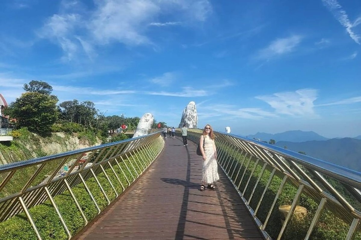 Golden Bridge Da Nang with scenic views of Ba Na Hills under a clear blue sky.