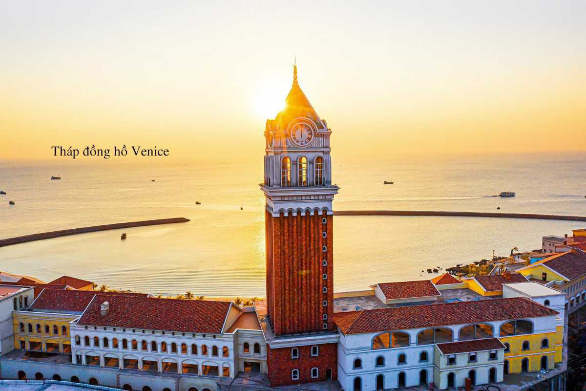 Clock Tower Phu Quoc with Golden Sunrise Golden sunrise shining on Clock Tower Phu Quoc and coastal horizon
