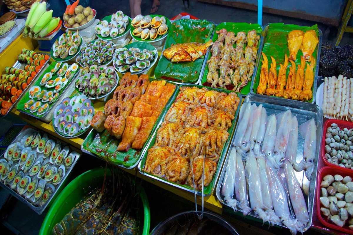 Variety of Seafood and Grilled Dishes Grilled seafood and prepared dishes displayed at Duong Dong Night Market