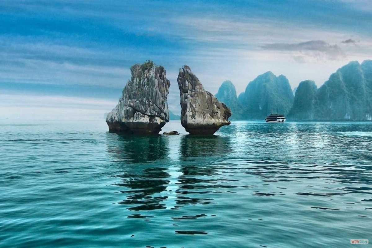 Ha Long Bay Twin Rocks Formation The famous twin rocks formation known as “Kissing Rocks” rising from calm waters in Ha Long Bay.