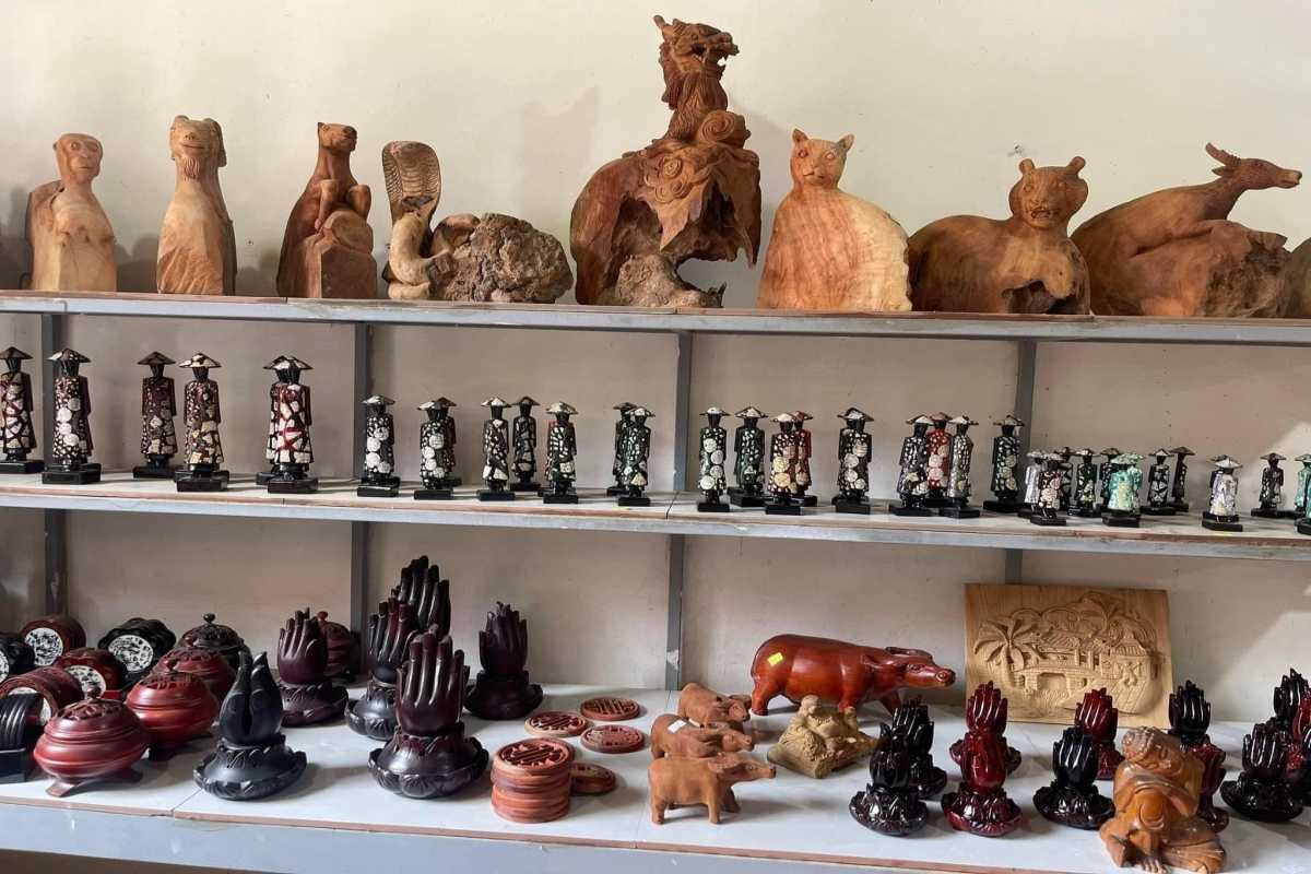 Handcrafted Wooden Sculptures at Kim Bong Village Display of handcrafted wooden animal sculptures and decorative items at Kim Bong Carpentry Village
