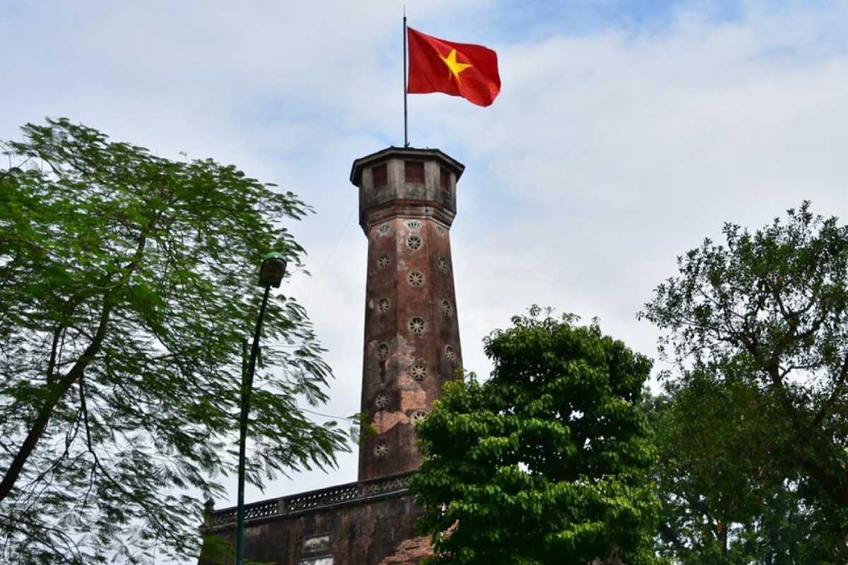 Hanoi Flag Tower with Cannon and Banners Hanoi Flag Tower decorated with banners and historic artillery