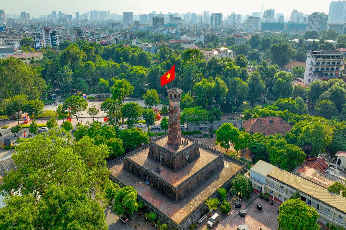 Hanoi Flag Tower with Vietnamese Flag Hanoi Flag Tower standing tall with the Vietnamese flag waving under a clear blue sky