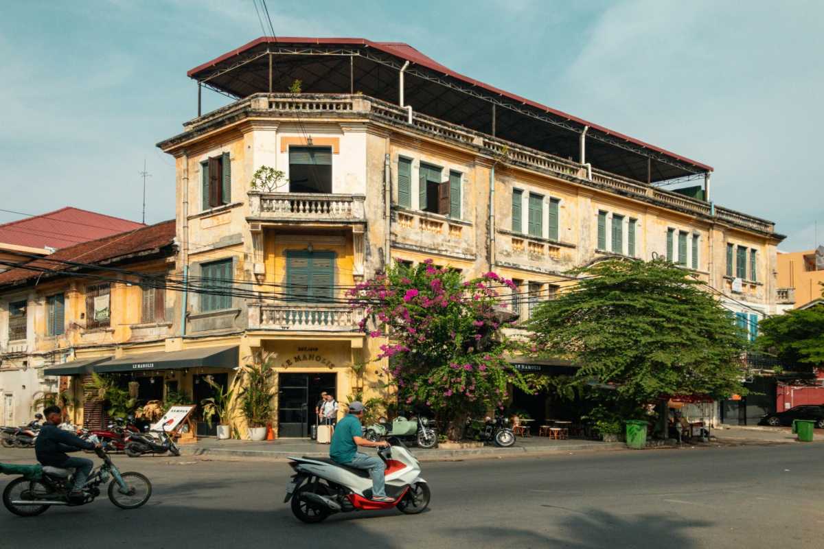 Hanoi French Quarter Traffic and Buildings Traffic and French colonial buildings in Hanoi French Quarter during sunset