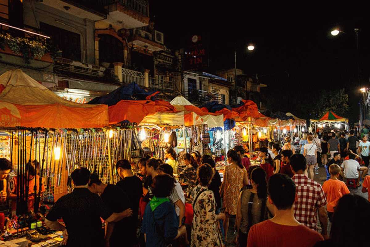 Hanoi Old Quarter night market stalls Crowded night market stalls with colorful tents and shoppers in the Hanoi Old Quarter