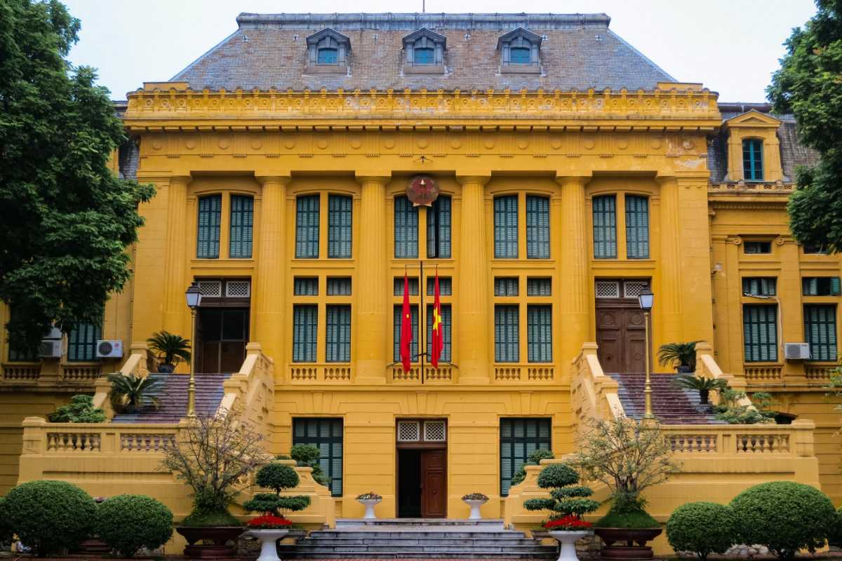 Hanoi Presidential Palace Main Entrance Facade The main yellow facade of the Hanoi Presidential Palace with large windows and decorative elements