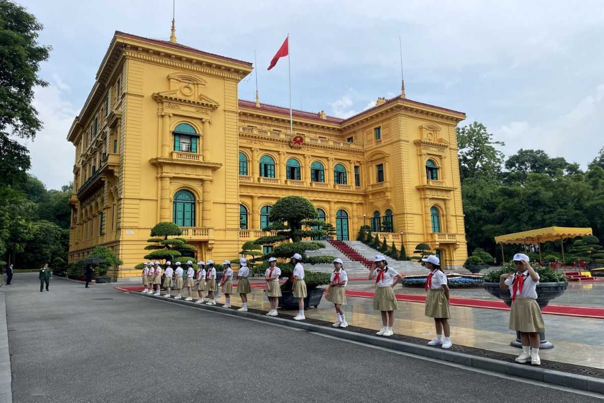 Hanoi Presidential Palace Official Guard at Main Gate Official guard standing at the main gate of the Hanoi Presidential Palace