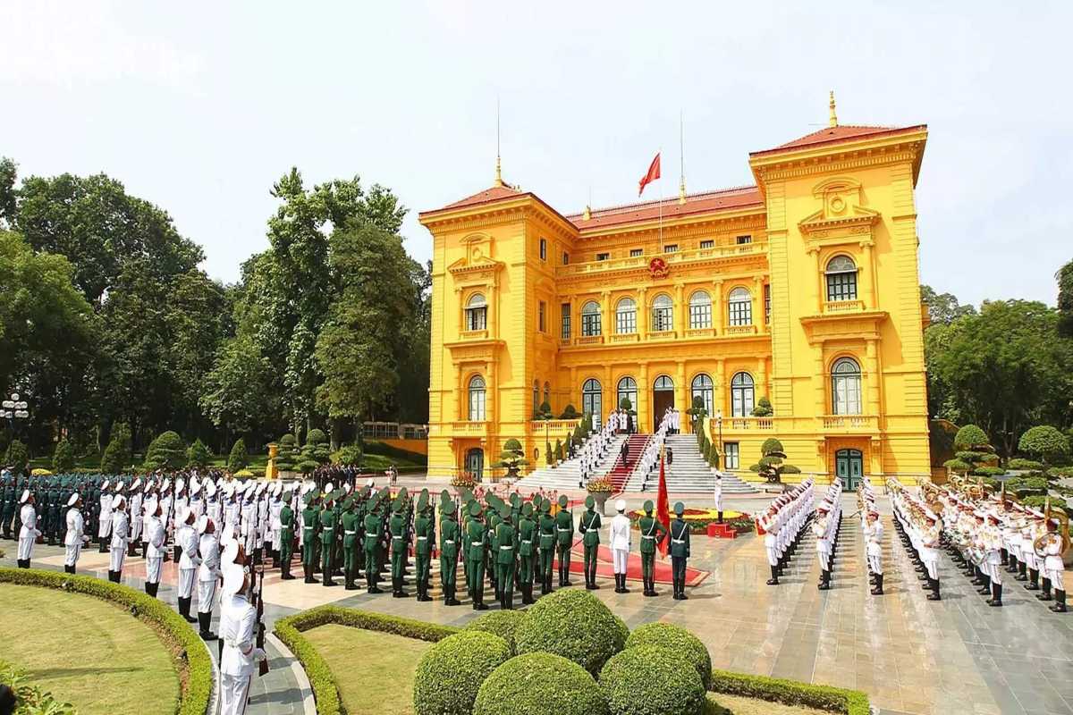 Hanoi Presidential Palace Front View with School Children School children in uniform standing in front of the Hanoi Presidential Palace entrance