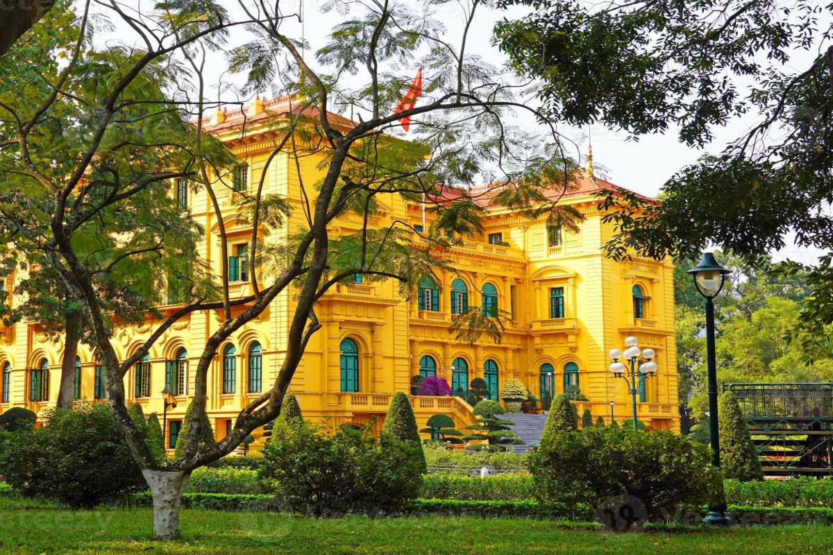 Hanoi Presidential Palace Side Garden and Trees Side garden view of the Hanoi Presidential Palace surrounded by tall trees and manicured shrubs