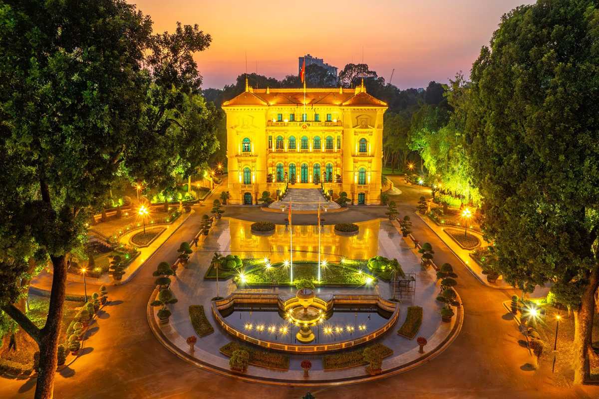 Hanoi Presidential Palace Illuminated at Sunset Illuminated Hanoi Presidential Palace at sunset with tranquil gardens and glowing lights