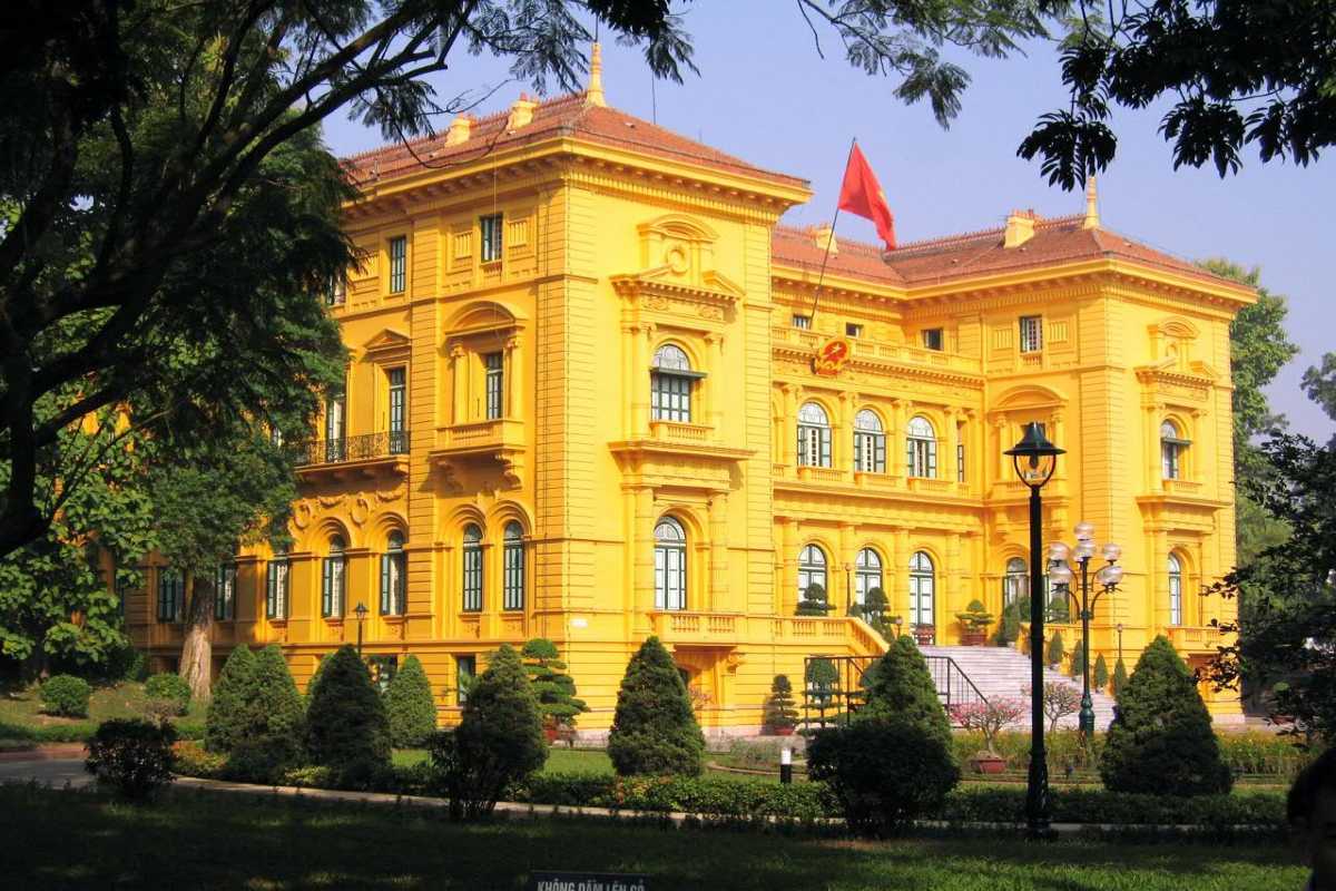 Hanoi Presidential Palace Yellow Facade with Lamps Close-up of the yellow facade of the Hanoi Presidential Palace lit by outdoor lamps