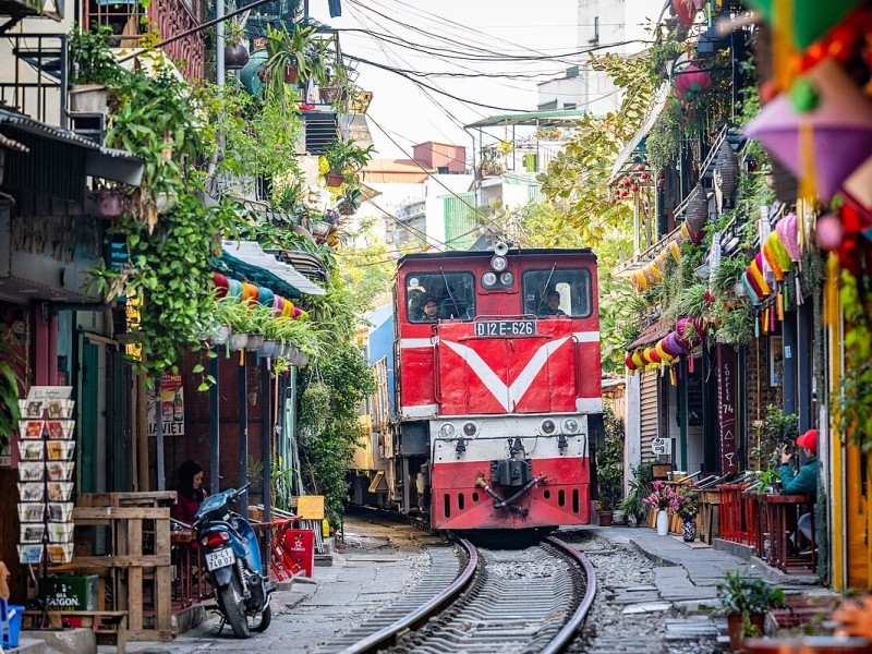 Cafés along Hanoi Train Street with train tracks visible