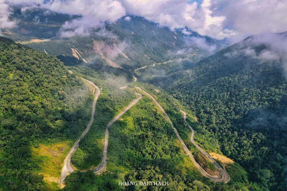 Winding mountain roads cutting through forested highlands on Heaven Pass route.