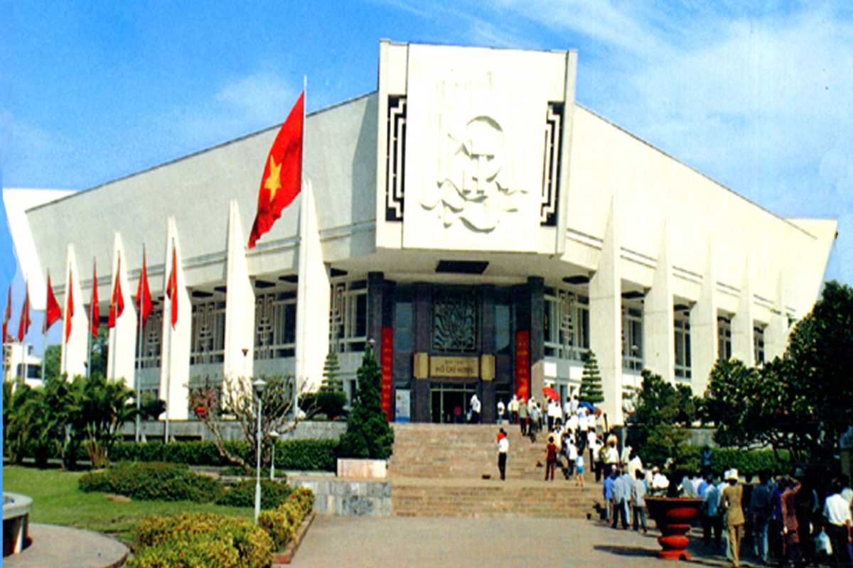 Ho Chi Minh Museum Building Entrance Entrance to the Ho Chi Minh Museum with Vietnamese flags and visitors