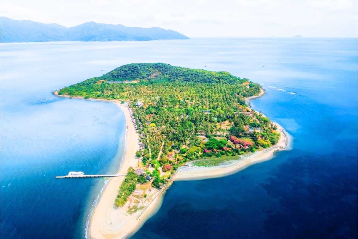 Aerial View of Hoa Lan Stream Orchid Island Nha Trang Natural Landscape Aerial view showing the lush greenery and coastline of Hoa Lan Stream and Orchid Island in Nha Trang.