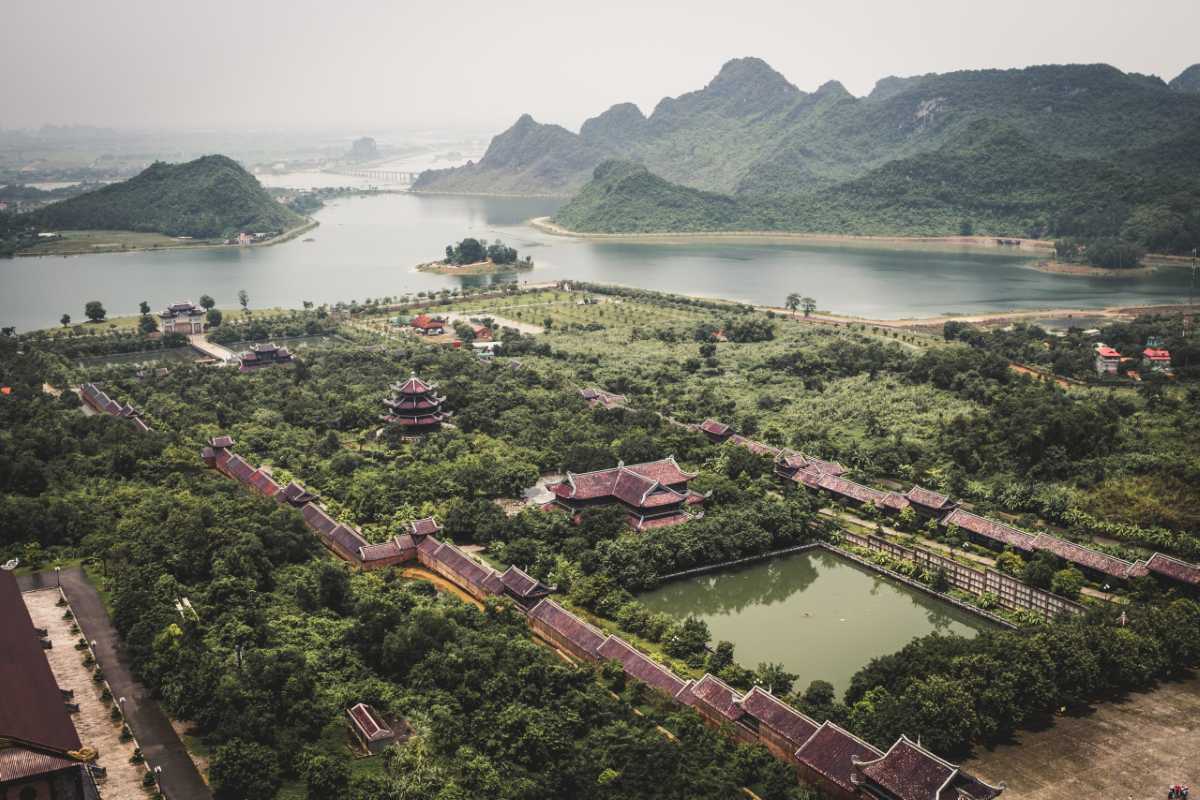 Hoa Lu Ancient Capital in Ninh Binh with Historic Temples Aerial view of Hoa Lu Ancient Capital surrounded by lush greenery and historic temples near Trang An Ninh Binh