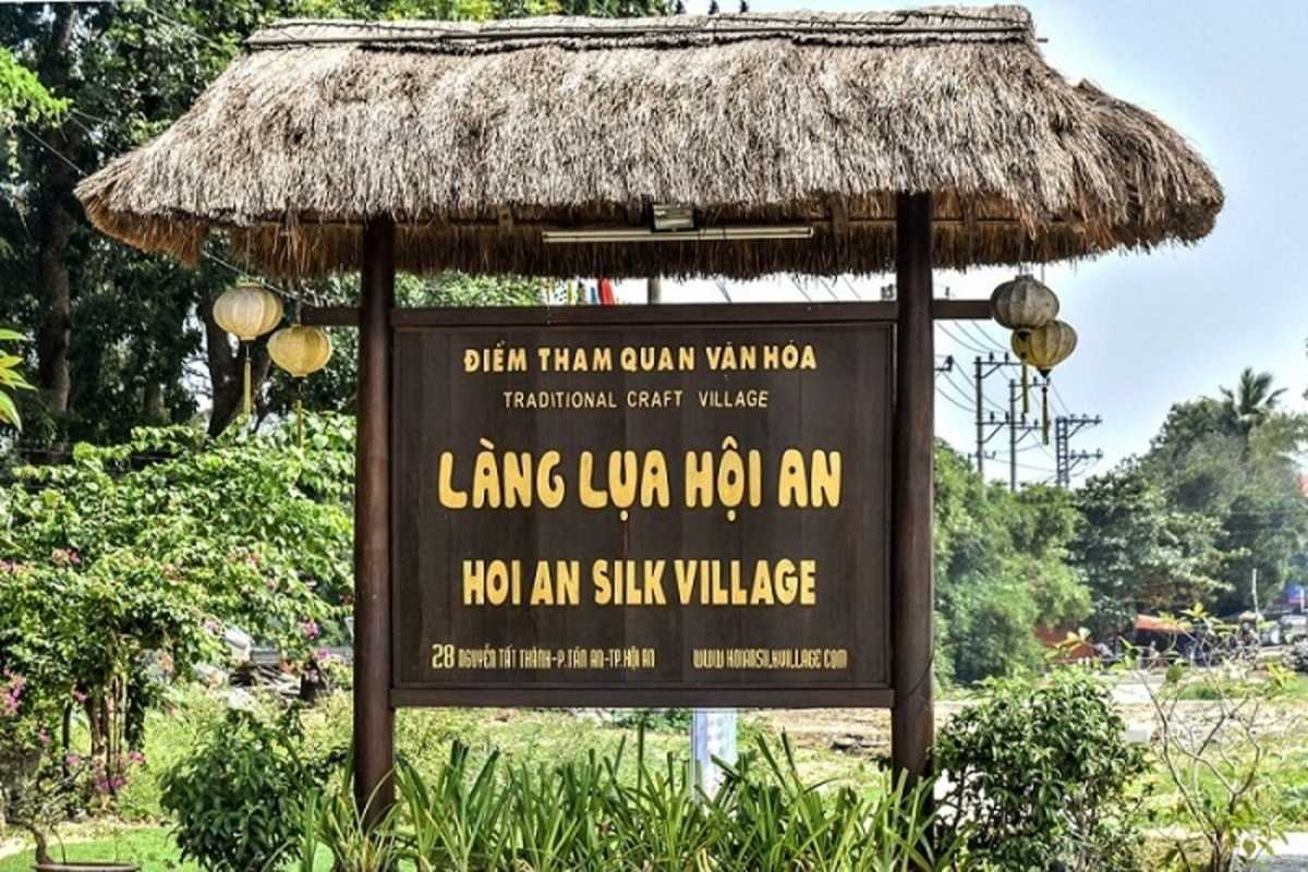 Thatched Roof Entrance Sign of Hoi An Silk Village Traditional thatched roof entrance sign welcoming visitors to Hoi An Silk Village