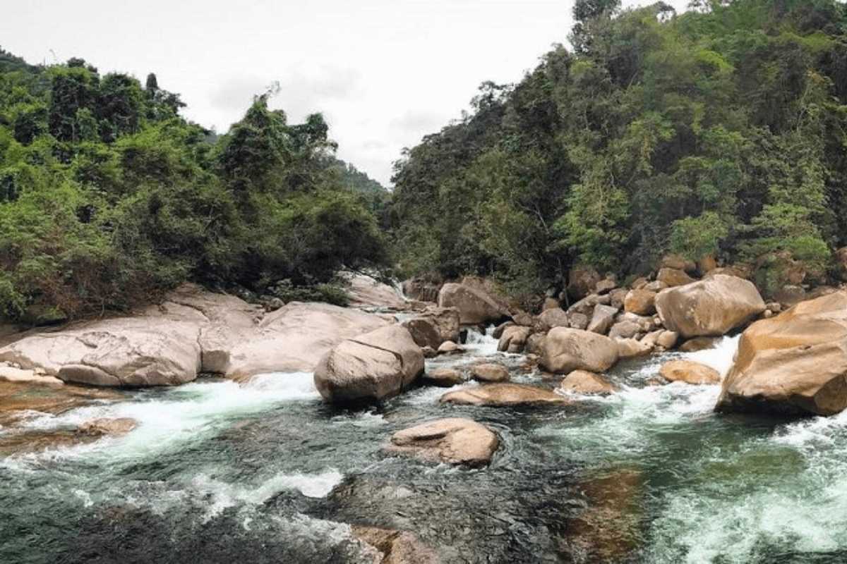 River Rapids and Rocky Landscape at Hon Ba Nature Reserve Fast-flowing river with large rocks in Hon Ba Nature Reserve Cam Lam