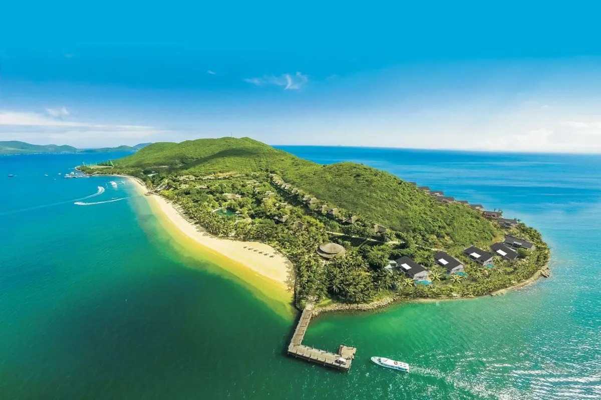 Aerial view of Hon Mun Island beach resort Aerial photo of Hon Mun Island showing beachfront villas and crystal-clear waters along a golden beach.