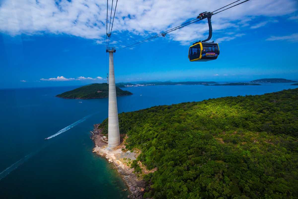 Hon Thom Cable Car over Beach and Boats Cable car floating above Phu Quoc Island beach crowded with boats and turquoise water