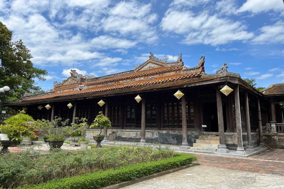 Exterior of Hue Museum of Royal Antiquities in the Imperial City Traditional wooden architecture and gardens at the entrance of Hue Museum of Royal Antiquities, Imperial City Hue