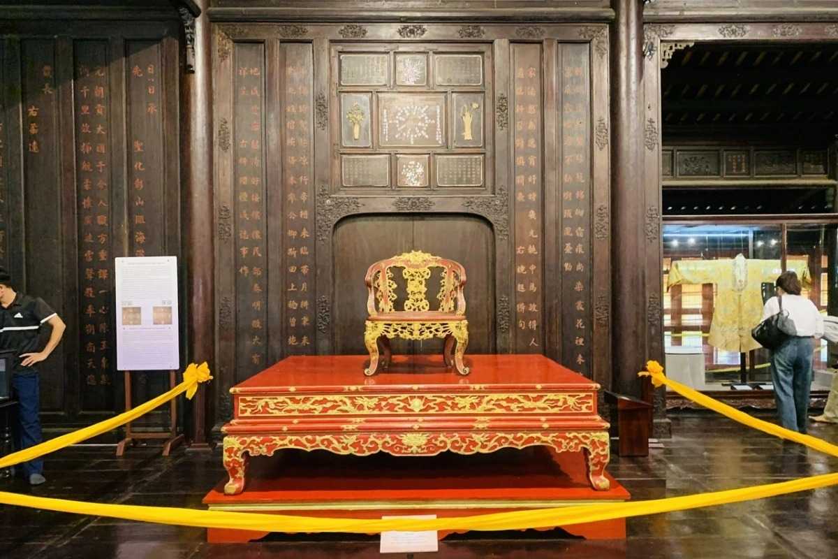 Imperial red and gold chair at Hue Museum of Royal Antiquities Imperial red and gold chair from the Nguyen Dynasty on display at Hue Museum of Royal Antiquities, symbolizing royal authority