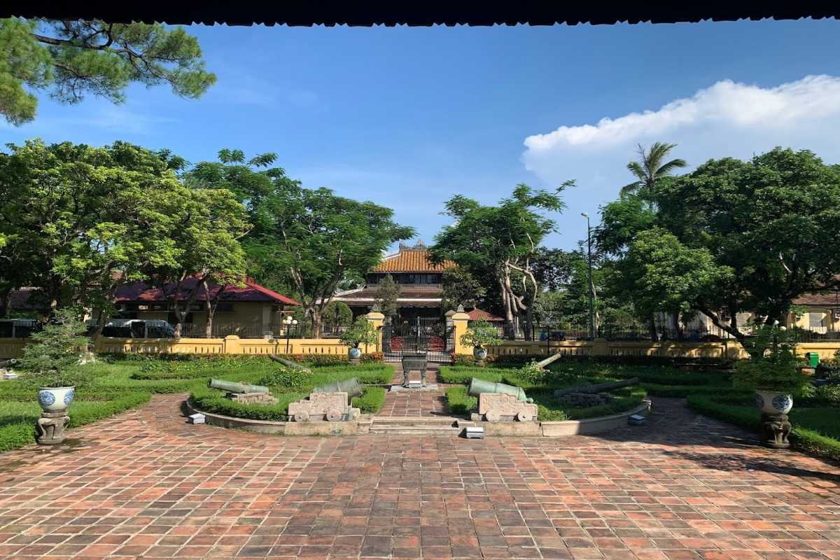 Museum gardens and cannons at Hue Museum of Royal Antiquities Tranquil museum gardens with historic cannons and greenery at Hue Museum of Royal Antiquities in Hue, Vietnam