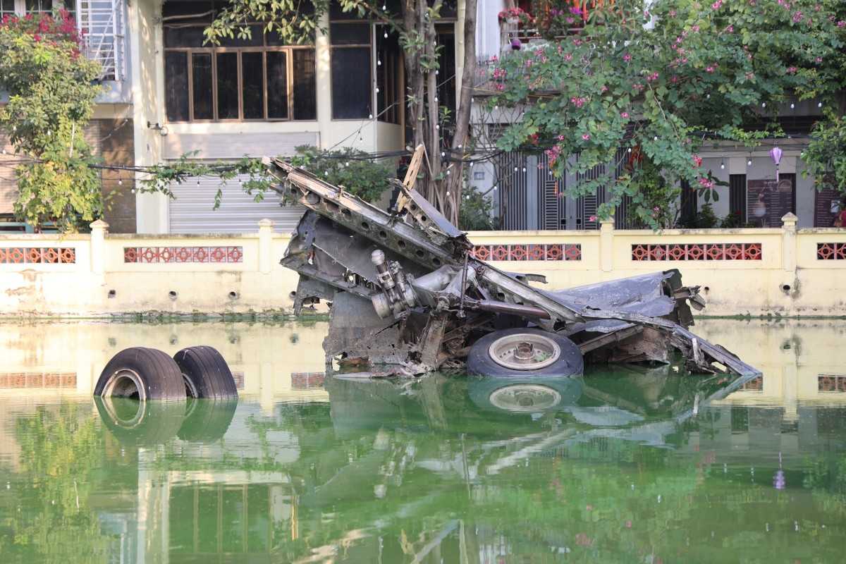 B-52 Lake’s Tranquil Setting in Hanoi Serene surroundings of B-52 Lake with iconic wreckage