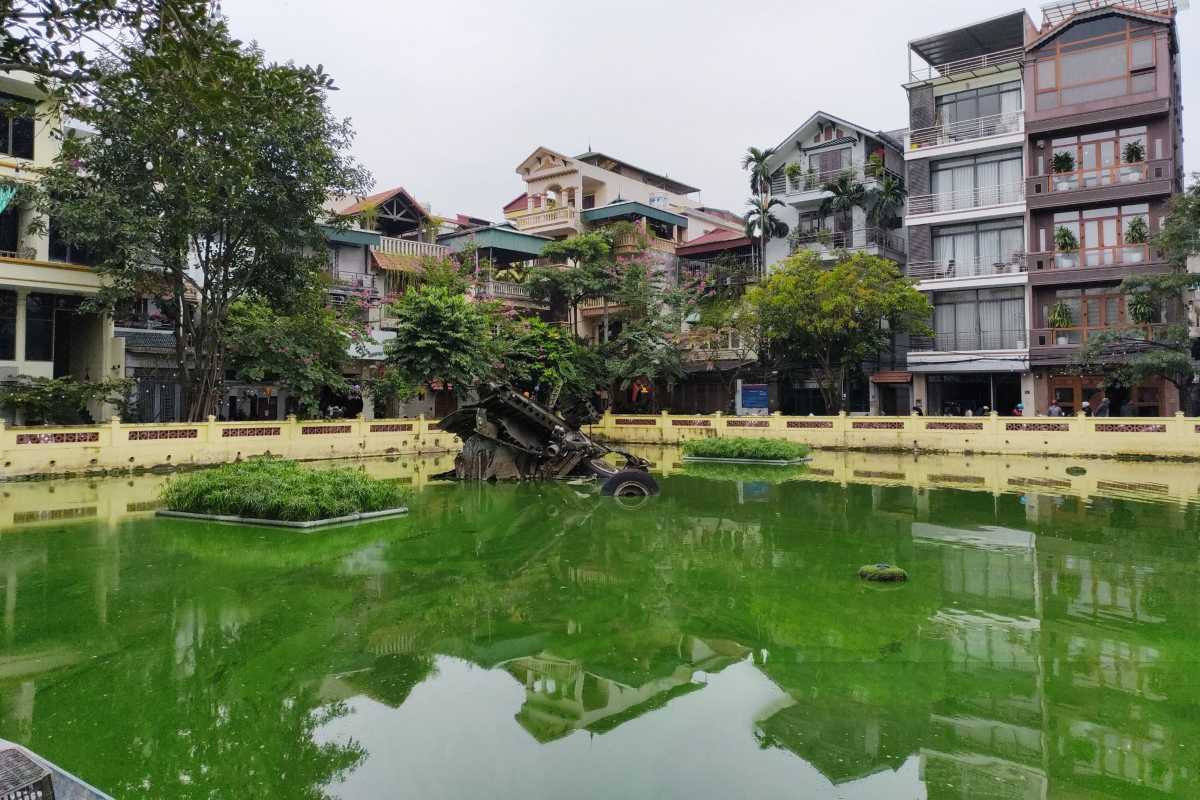 Huu Tiep Lake Hanoi and B-52 Warplane Wreckage View of Huu Tiep Lake Hanoi with B-52 warplane wreckage and surrounding city buildings