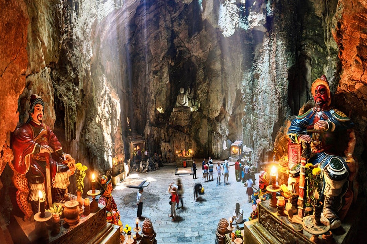 Huyen Khong Cave at Marble Mountains, Da Nang - showcasing ancient statues and mystical sunlight beams