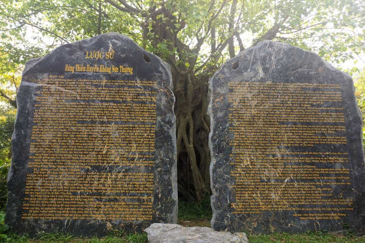 Huyen Khong Son Thuong Pagoda Hue historic stone tablets under sacred tree Huyen Khong Son Thuong Pagoda Hue historic stone tablets inscribed with golden text under ancient tree in temple grounds