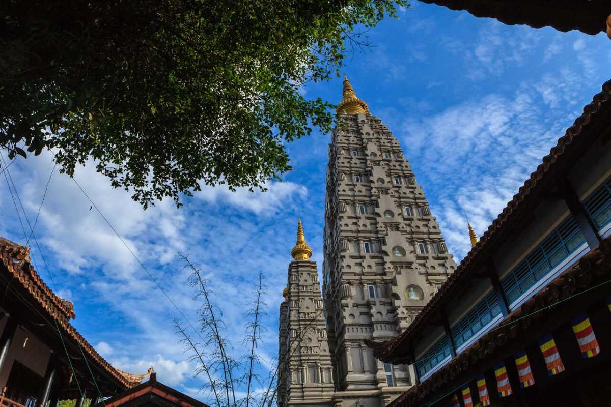 Huyen Khong Son Thuong Pagoda Hue iconic stone stupa under blue sky Huyen Khong Son Thuong Pagoda Hue iconic stone stupa rises against a blue sky, golden spires, and elegant courtyard below