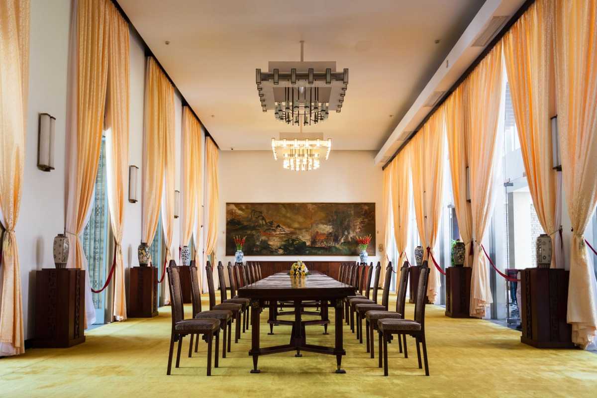 Independence Palace Saigon Banquet Hall Interior Interior view of Independence Palace Saigon banquet hall with elegant chandeliers and long dining table