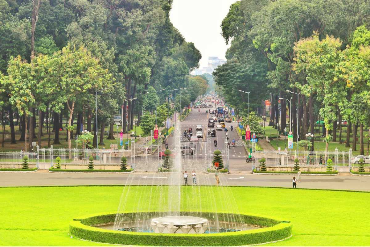 Independence Palace Saigon Front Garden and Fountain Independence Palace Saigon front garden with fountain and lush green lawns framed by tall trees