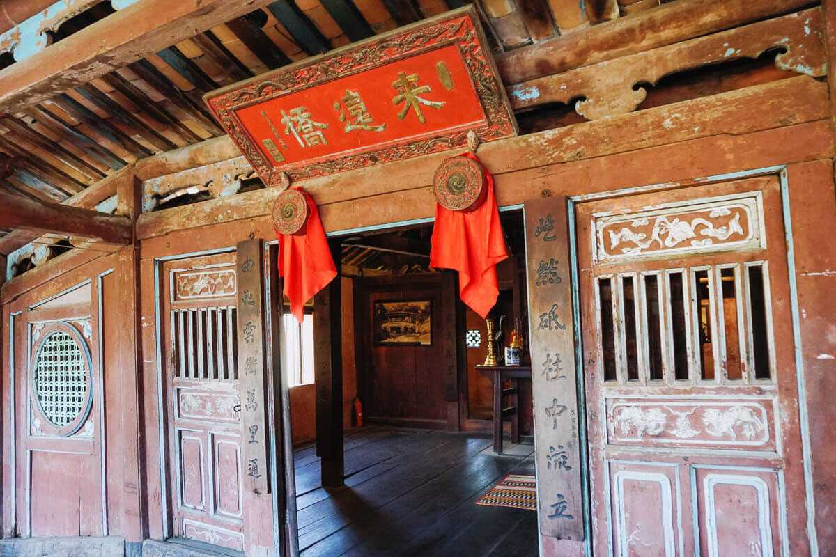 Interior view of the Taoist temple on Japanese Bridge Hoi An Inside the Taoist temple on the Japanese Bridge Hoi An, featuring wooden pillars and traditional decor