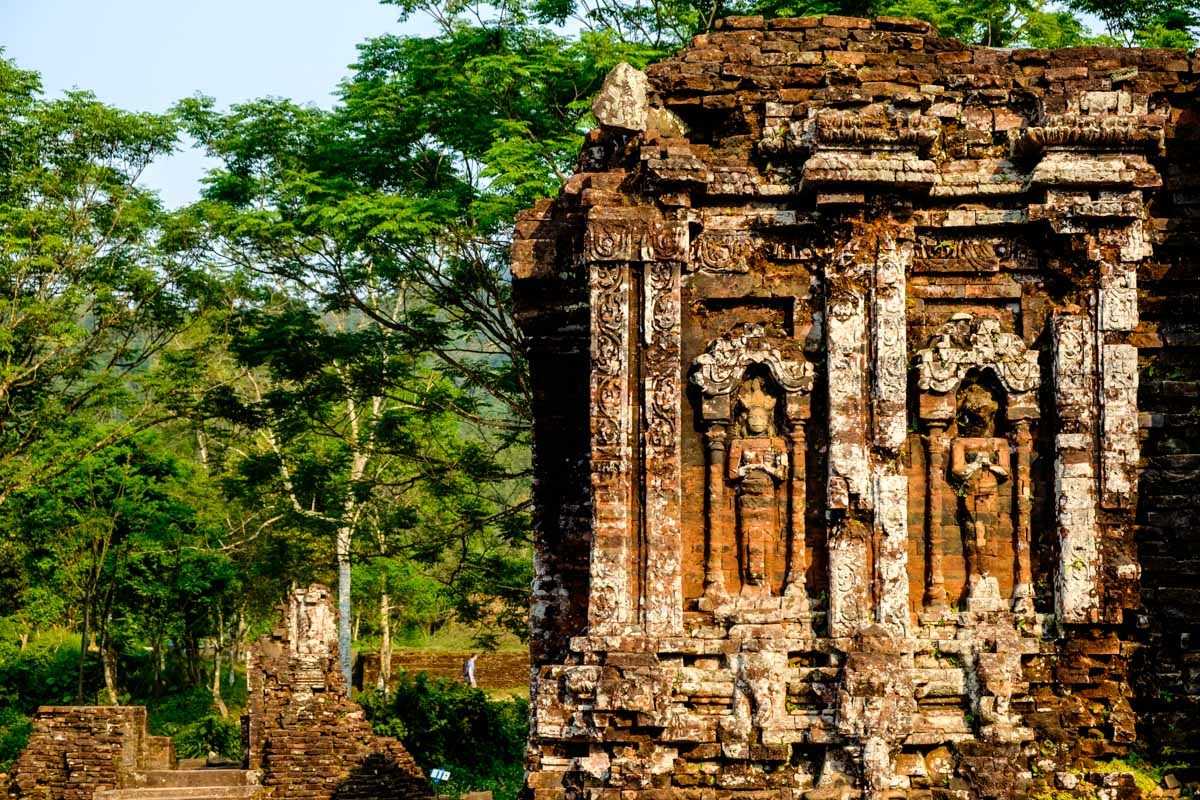 Intricate Stone Carvings at My Son Sanctuary Close-up of detailed stone carvings on historic temple walls at My Son Sanctuary Vietnam, highlighting Cham artistry and heritage preservation