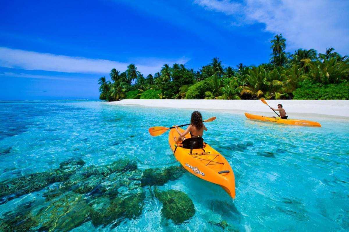 Kayaking Over Clear Waters at May Rut Trong Island Two kayakers paddling over crystal-clear waters near May Rut Trong Island in Phu Quoc