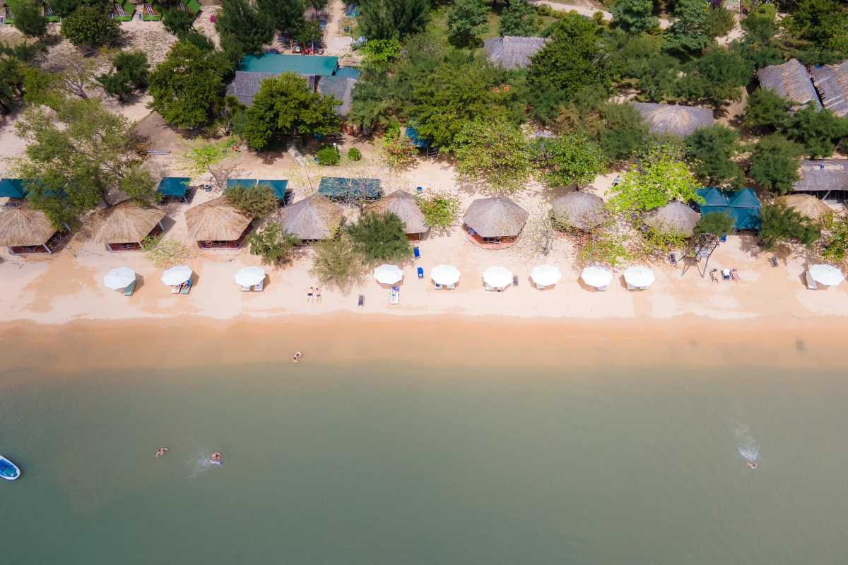 Kayaking Group Enjoying Orchid Stream Island Waters Group kayaking on calm waters at Orchid Stream Island surrounded by forested hills in Nha Trang