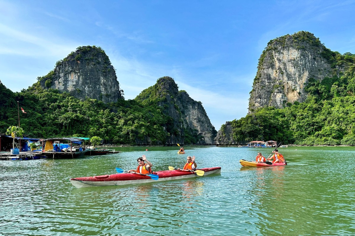 Kayaking through Vung Vieng Fishing Village surrounded by limestone karsts