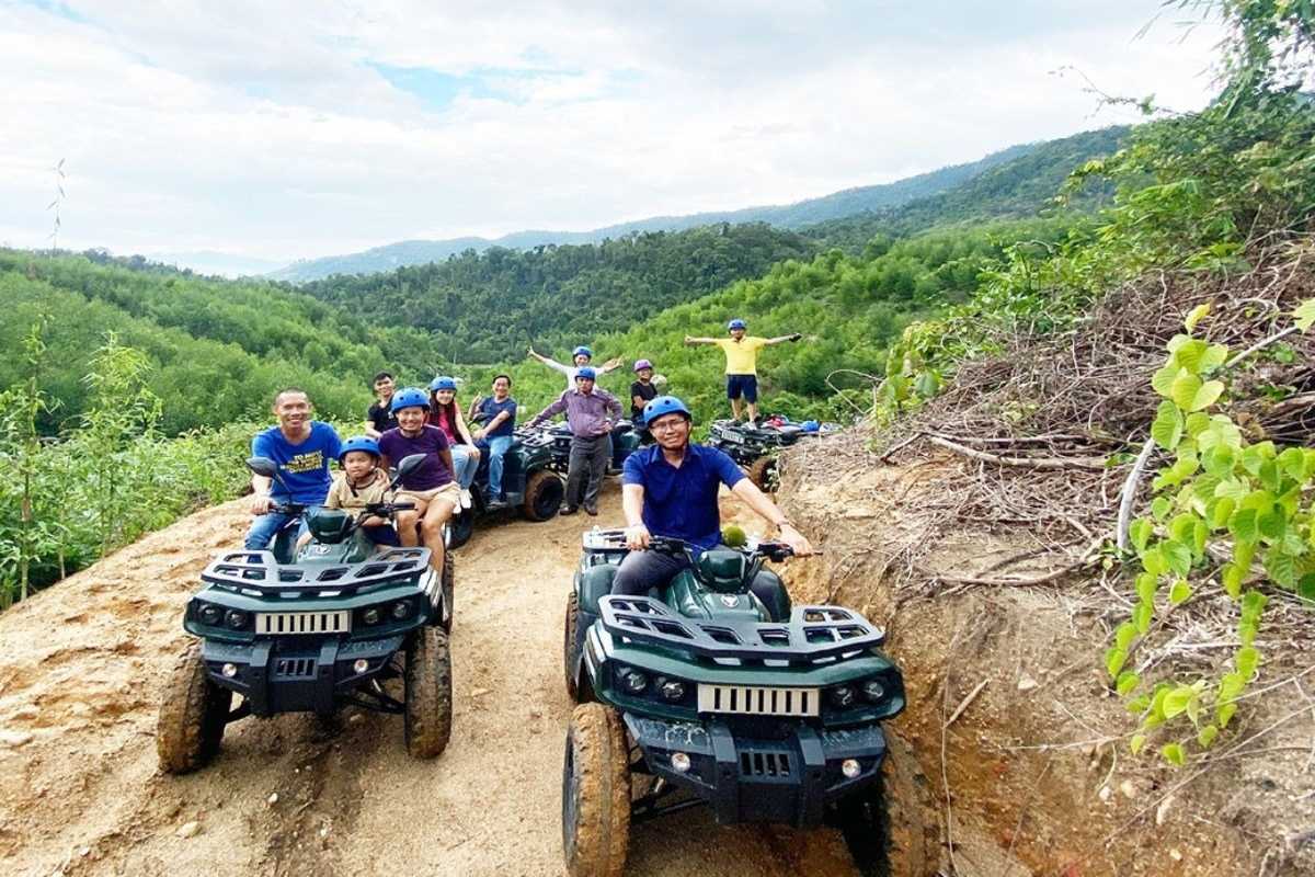 Kong Forest ATV Adventure in Hon Ba Nature Reserve Group riding all-terrain vehicles on dirt trails through Kong Forest at Hon Ba Nature Reserve