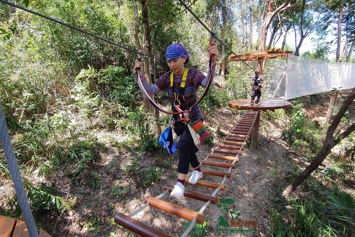 Kong Forest Rope Bridge Trekking Trail Visitor crossing rope bridge on trekking trail inside Kong Forest at Hon Ba Nature Reserve