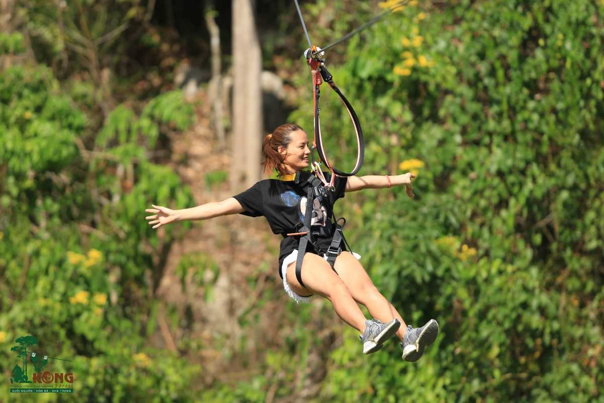Kong Forest Zipline Ride Experience Tourist enjoying zipline ride through forest canopy in Kong Forest at Hon Ba Nature Reserve