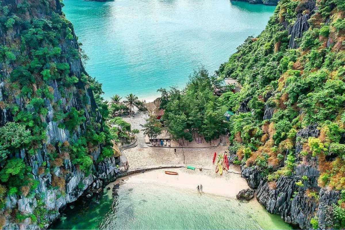 Lan Ha Bay Vietnam panoramic aerial view of bay and islets Panoramic aerial view of Lan Ha Bay with scattered limestone islets and emerald waters under blue sky.