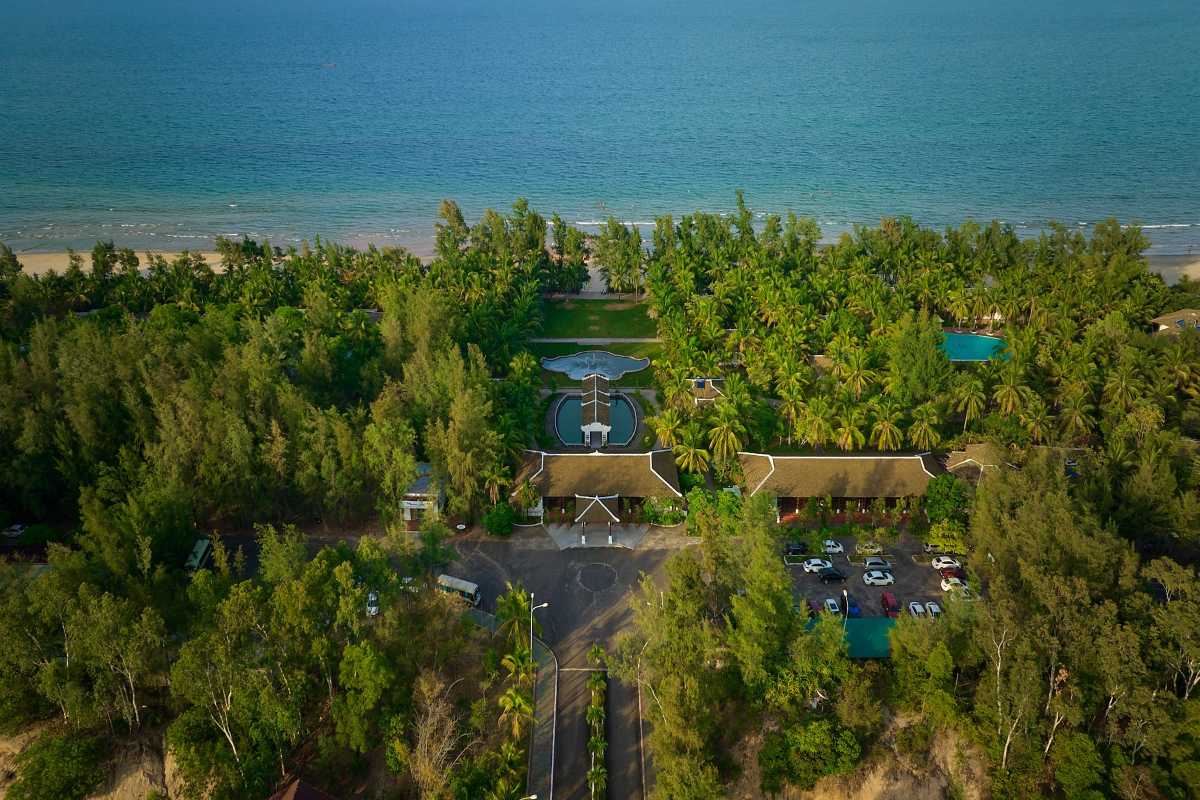 Lang Co Beach Hue beachfront resort and tropical garden view Lang Co Beach Hue features a beachfront resort surrounded by lush palm gardens with direct access to the sea and ample parking.