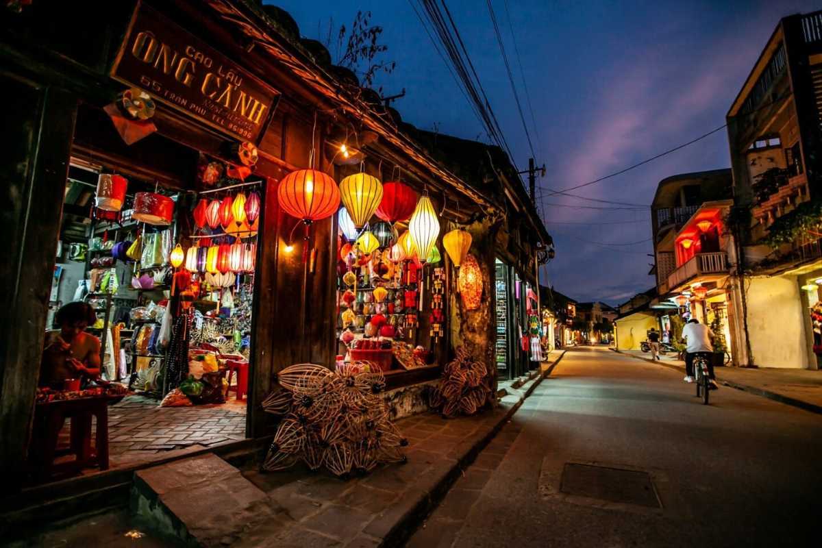 Lantern Shop Illuminated at Dusk in Hoi An Night Market Traditional lanterns hanging and lit up outside a shop in the Hoi An Night Market during dusk